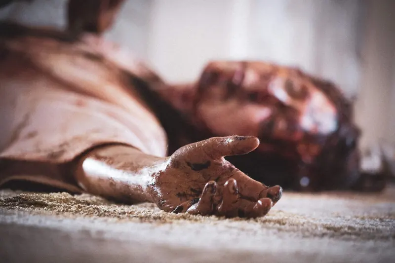 Maggie May: a blood-smeared hand reaching across bedroom carpet