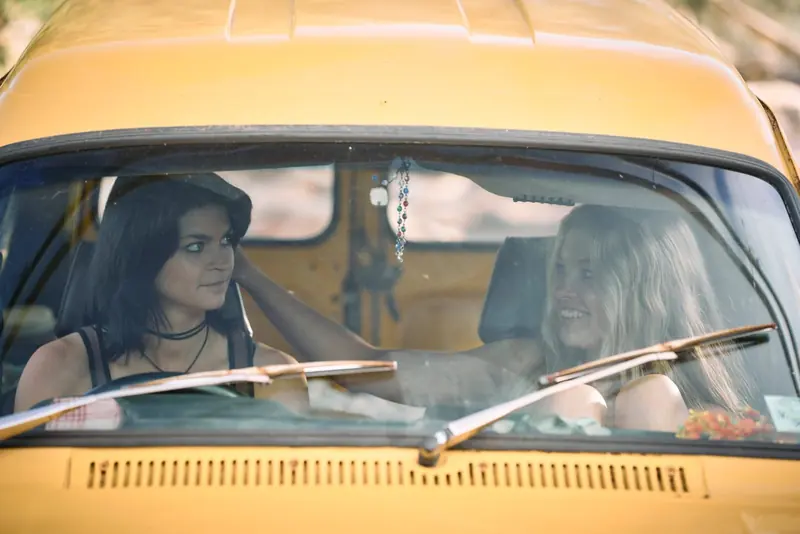 Penny Lane Is Dead: two young women seen through the windscreen of a yellow van